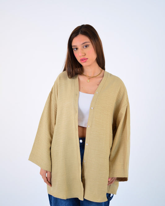 Woman wearing a beige cardigan