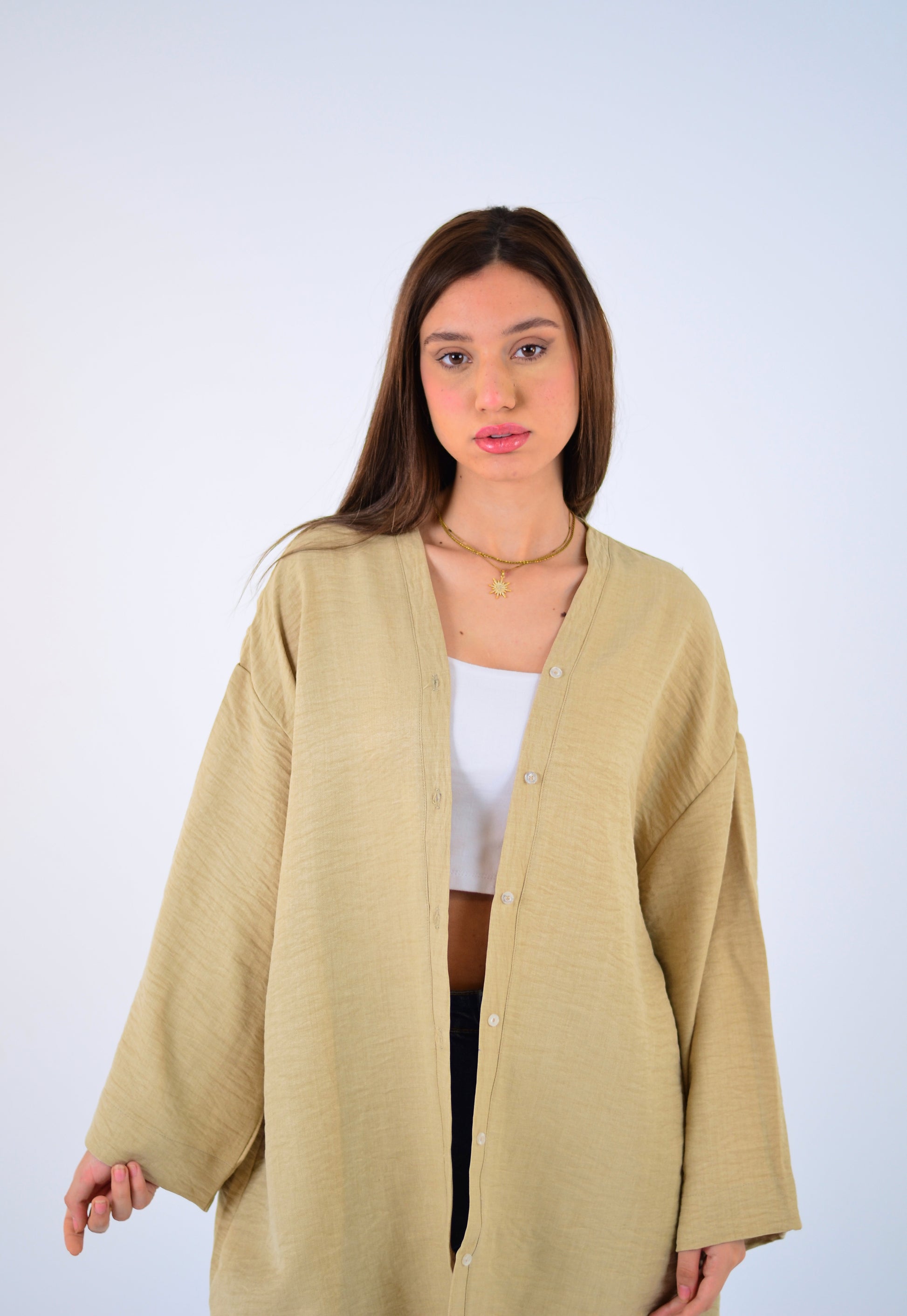 Woman wearing a beige cardigan