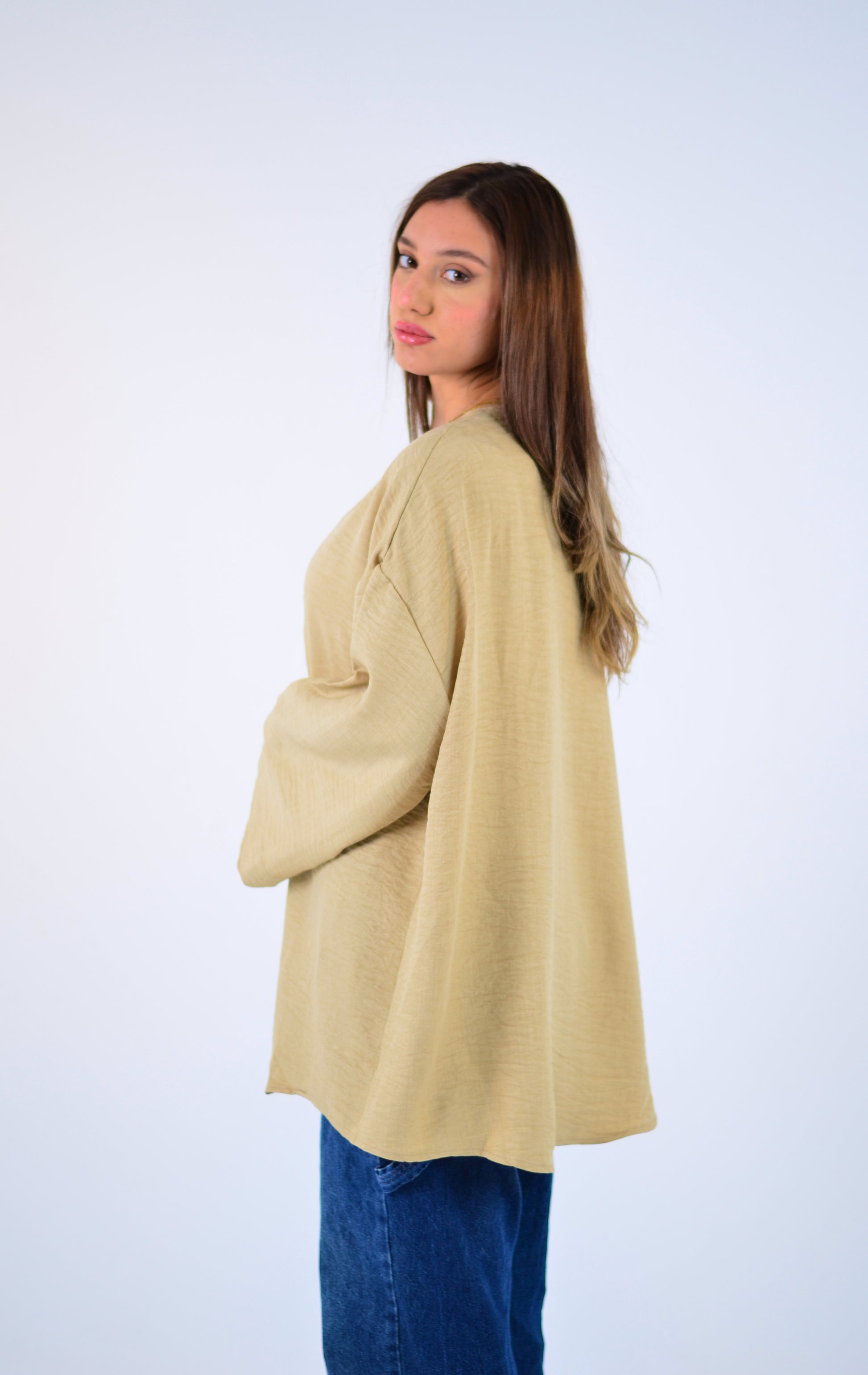 Woman wearing a beige cardigan